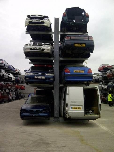cantilever-racking-for-cars double sided cantilever racking at a scrap car yard. Cars stored on four levels