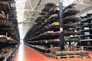 warehouse with cantilever racks, stcoked with metal bars