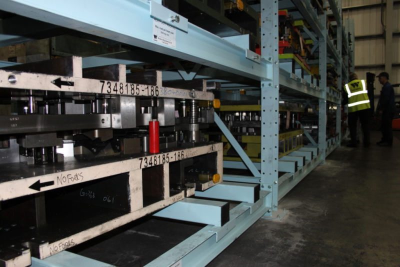 tools stored on fork entry bars of heavy duty racking